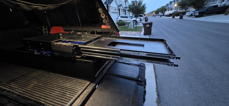 Fridge slide extended from the truck bed showing the full-extension slide rails — photo 4