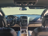 Interior view of a spacious vehicle, ideal for an RV rental adventure, featuring dashboard, steering wheel, and front cabin.