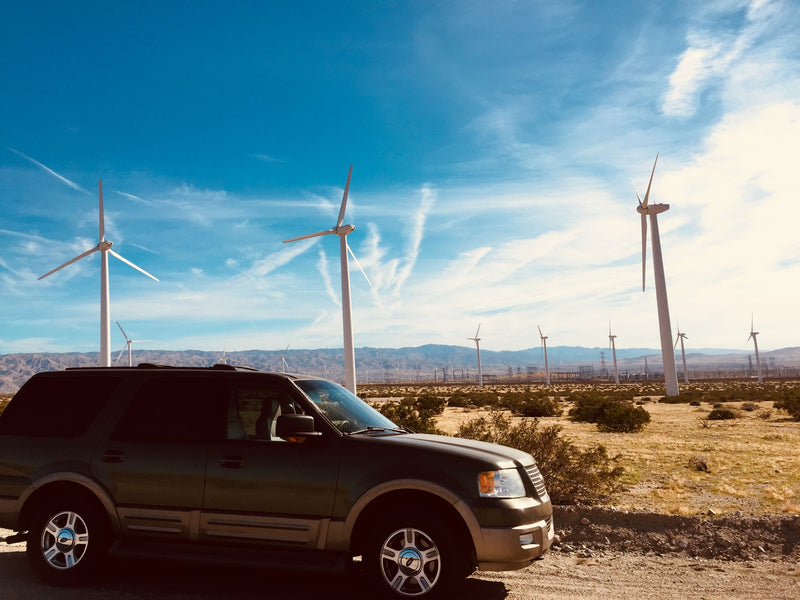  and USB cables on the floor for travel charging.|Modified SUV's rear converts into a compact rv rental — photo 14