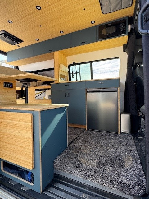  and off-road tires. Ready for exploration.|Stylish RV rental interior: bed — photo 3