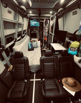 Adventure-ready RV rental interior: seating, bed, workstation, and gear storage for winter sports & travel.