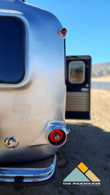 A classic Airstream RV rental, perfect for glamping by the lake. Enjoy outdoor adventures!