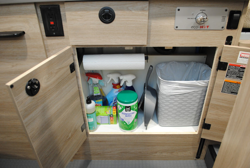  and a Xantrex solar charge controller.|Compact rv rental interior with kitchenette: sink — photo 14