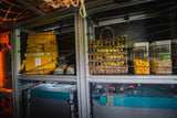 RV rental interior: organized gear, food, & power systems ready for adventure.