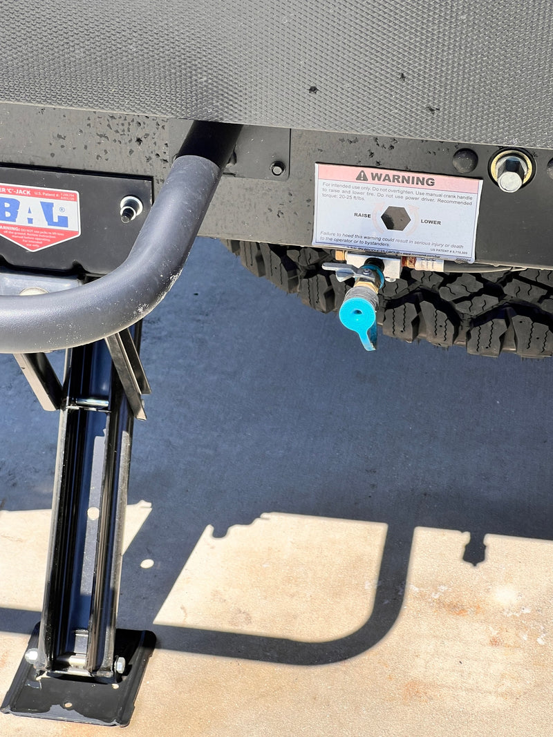  and 'EXTEND/RETRACT' controls for the automatic leveling/stabilizing jacks visible on its exterior panel.|RV rental exterior shows a water fill port — photo 10