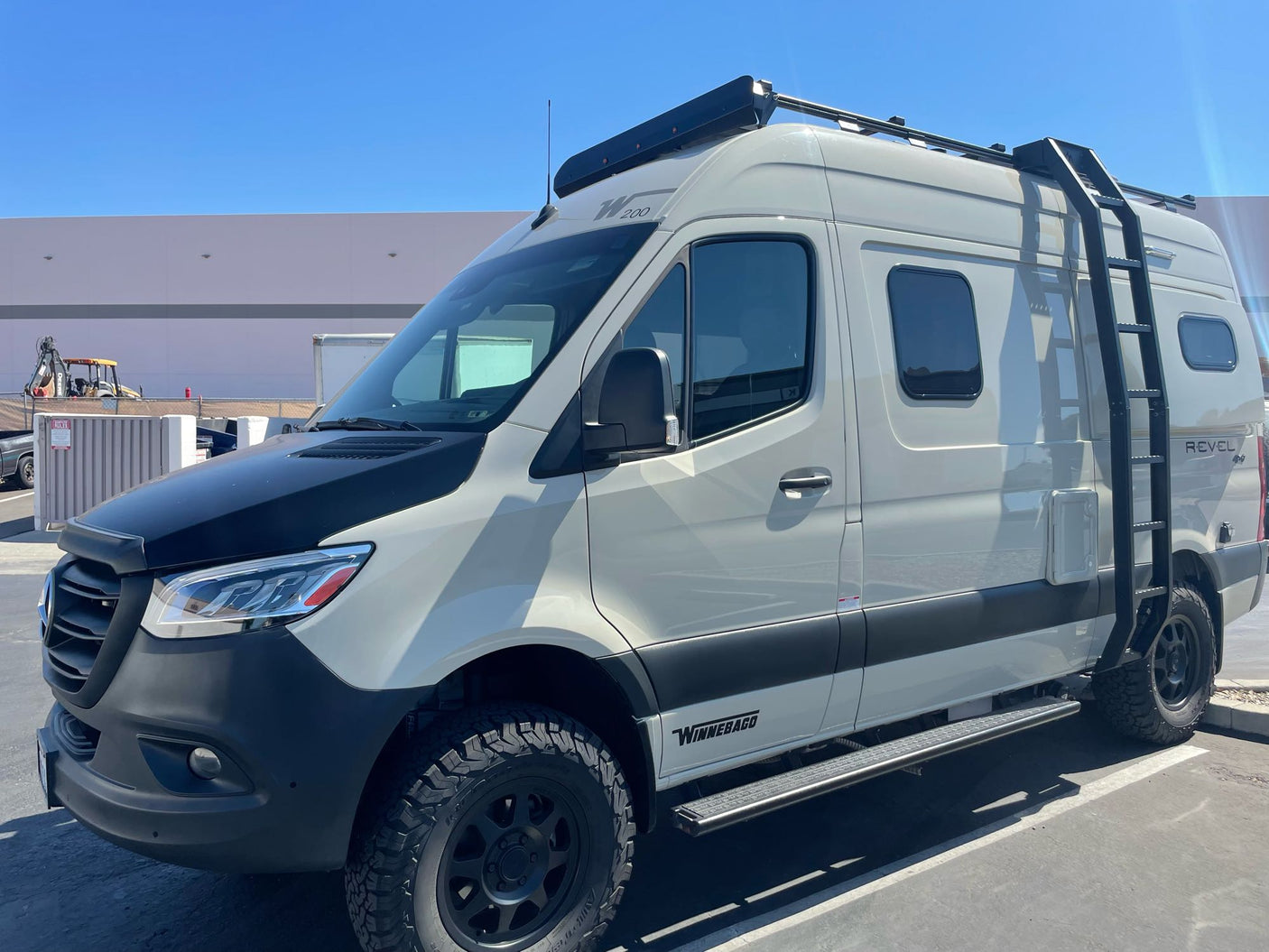 This rugged Winnebago Revel 4x4 camper van, an ideal RV rental, is designed for off-road adventures and road trips.