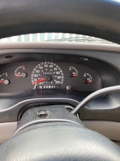 RV rental dashboard: speedometer, odometer at 024737.4 miles, and a full fuel gauge. Vehicle interior details.