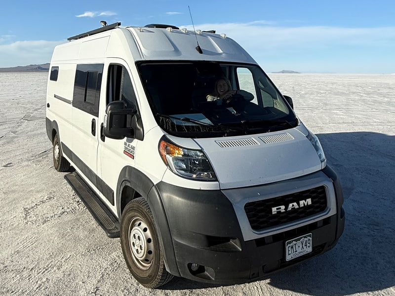 Adventure awaits! This RV rental camper van explores vast salt flats with a happy driver — photo 1