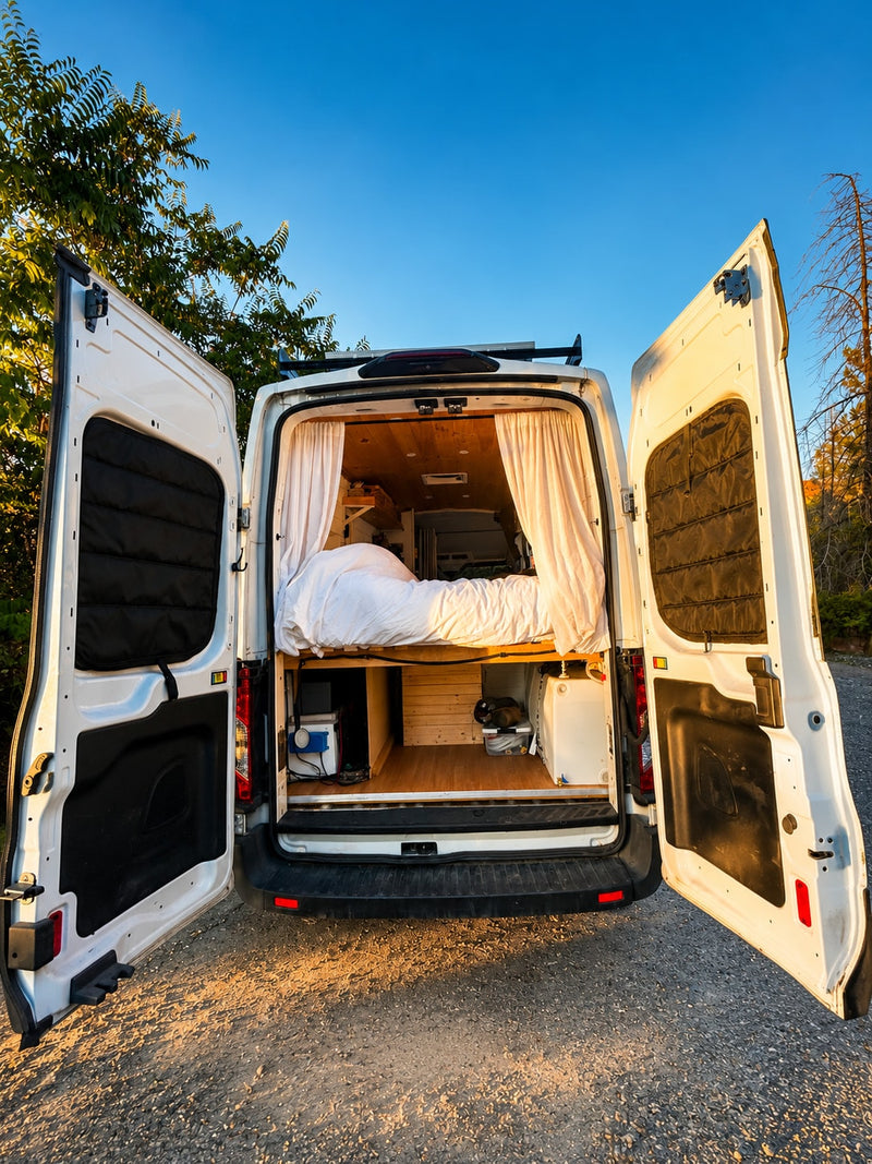  parked on dirt road with mountains & desert plants under a blue sky.|This RV rental features a modern kitchen with a wooden countertop — photo 5