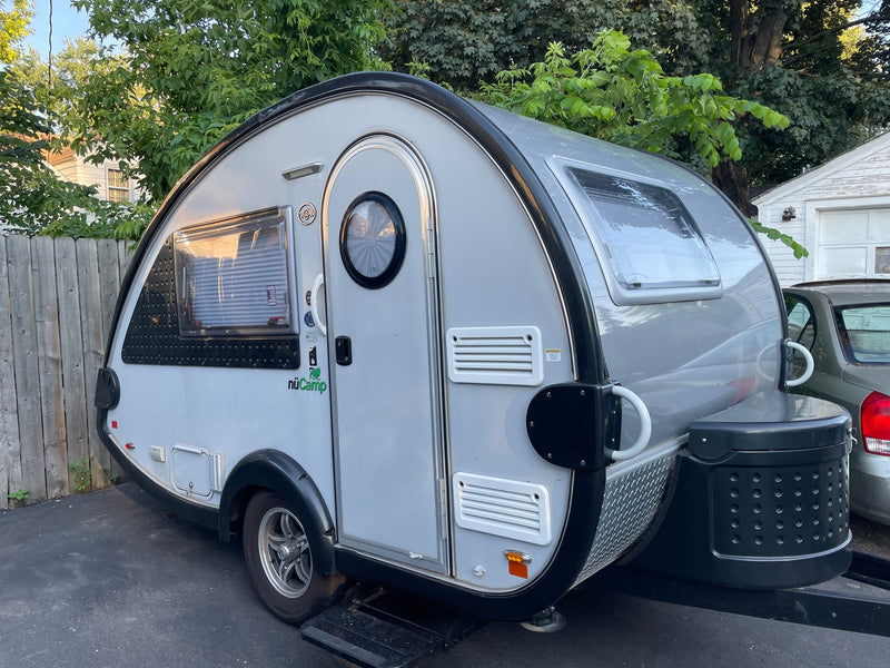  and TV.|Inside this RV rental: A compact kitchen with stainless steel sink — photo 7