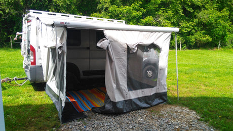 RV rental with Fiamma F65S awning extended to a tent for outdoor camping. Perfect for comfortable van life adventures.