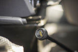 An RV rental's 4x4 transfer case shifter, showing 4LO, N (neutral), 2HI, and 4HI settings for varied terrain driving.