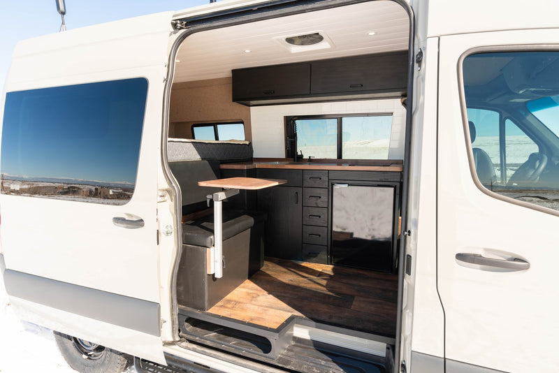 and panoramic snowy views.|RV rental van's 46 NORTH LONG kitchen: sleek wooden countertop — photo 7
