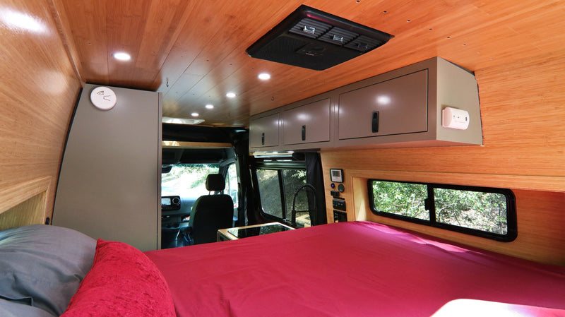  and fridge. Great for travel.|Modern RV rental kitchen featuring an open fridge with freezer drawer — photo 15
