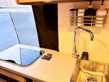 Enjoy a functional kitchen in this rv rental, with a built-in cooktop, sink, dish & hand soap. Ready for your adventure.
