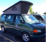 A dark green VW pop-top camper van with its roof raised, ideal for your next rv rental adventure.