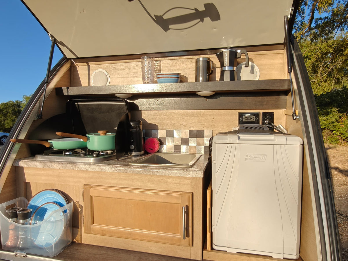  and a refreshing nature view from the window.|White truck and colorful RV rental teardrop camper by a scenic lake — photo 8