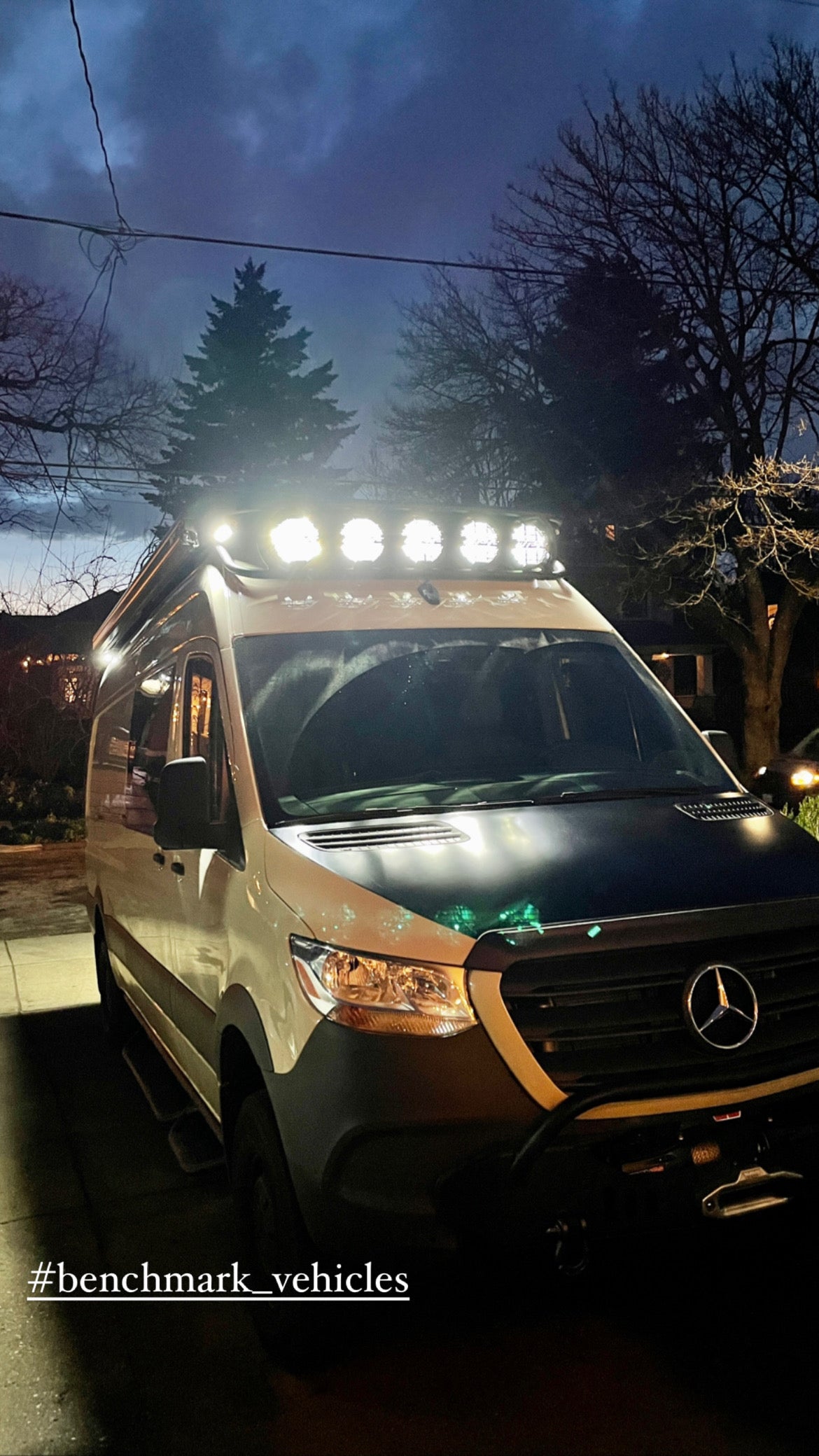 Bright custom lights illuminate this Mercedes Sprinter adventure RV, ready for your next RV rental journey.