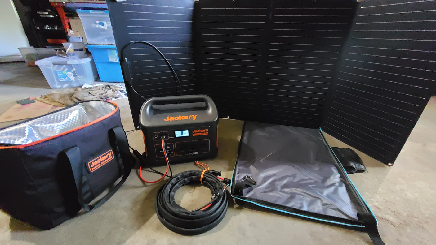 Jackery solar power setup for an RV rental trip: portable station, panels, and cooler bag. Ready for off-grid adventures.