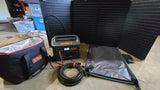 Jackery solar power setup for an RV rental trip: portable station, panels, and cooler bag. Ready for off-grid adventures.