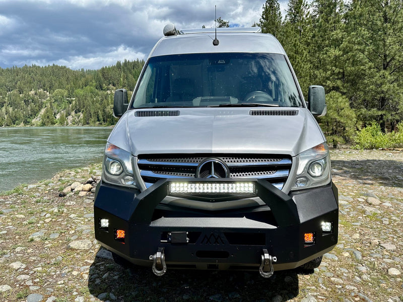 ready for outdoor adventure.|Off-road silver Sprinter camper van by a scenic river — photo 2