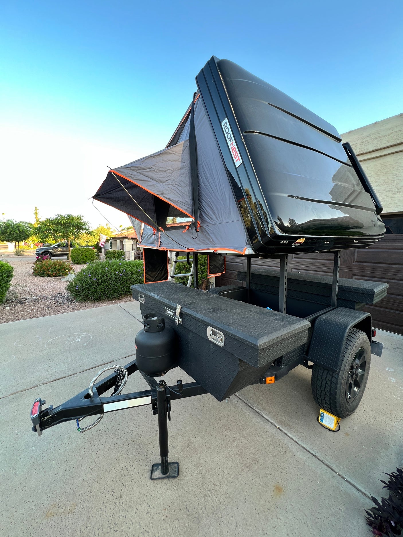 Overland camping trailer with a Roofnest rooftop tent, perfect for your next RV rental adventure.
