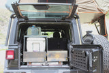 Open Jeep Wrangler with overland storage, cooler, water, and rooftop tent. Ideal for your next RV rental camping trip!