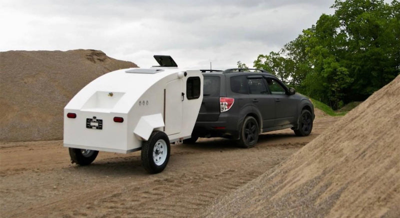  tying shoes. Experience an RV rental!|Exploring outdoors: One woman photographs another posing beside a compact white RV rental — photo 3