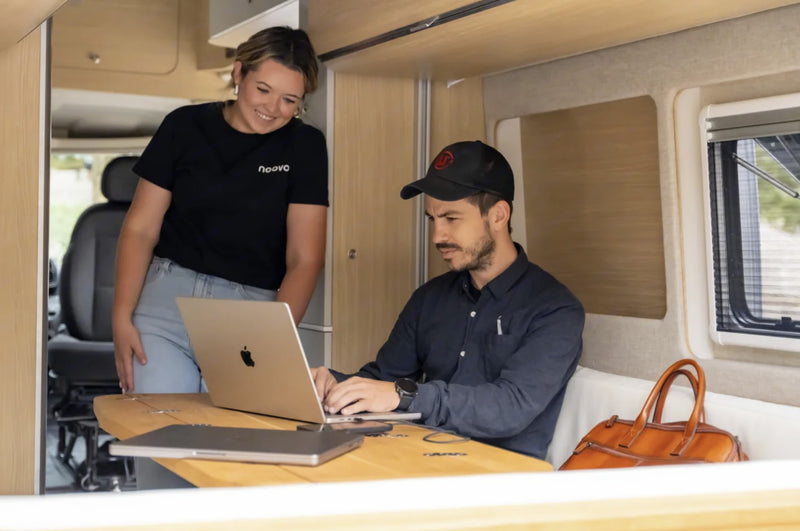  and light wood paneling.|Inside a modern RV rental — photo 5