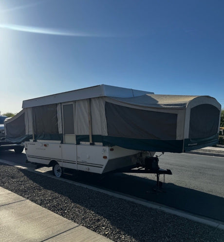  is ready for your next camping adventure.|Enjoy this pop-up RV rental interior with a bed