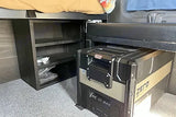 RV rental interior: under-bed storage shelves & an ARB ZERO portable fridge on carpeted floor.