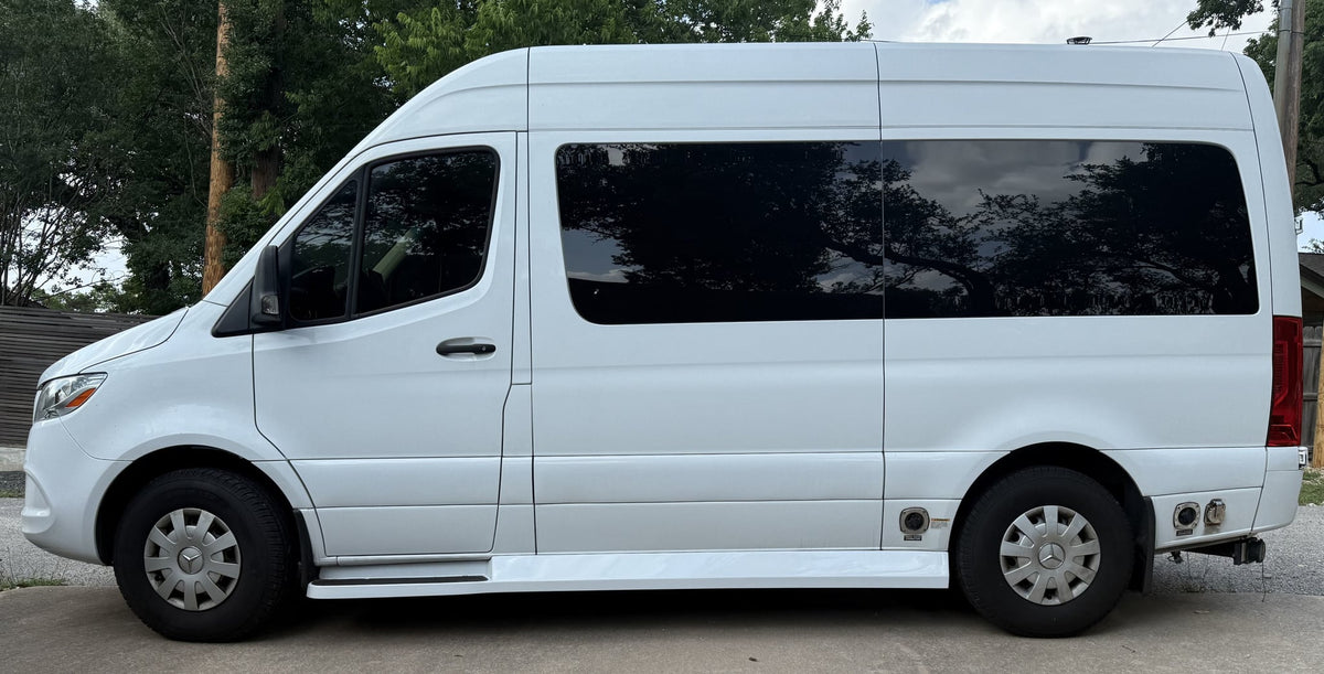 Side view of a white Mercedes-Benz Sprinter camper van — photo 1