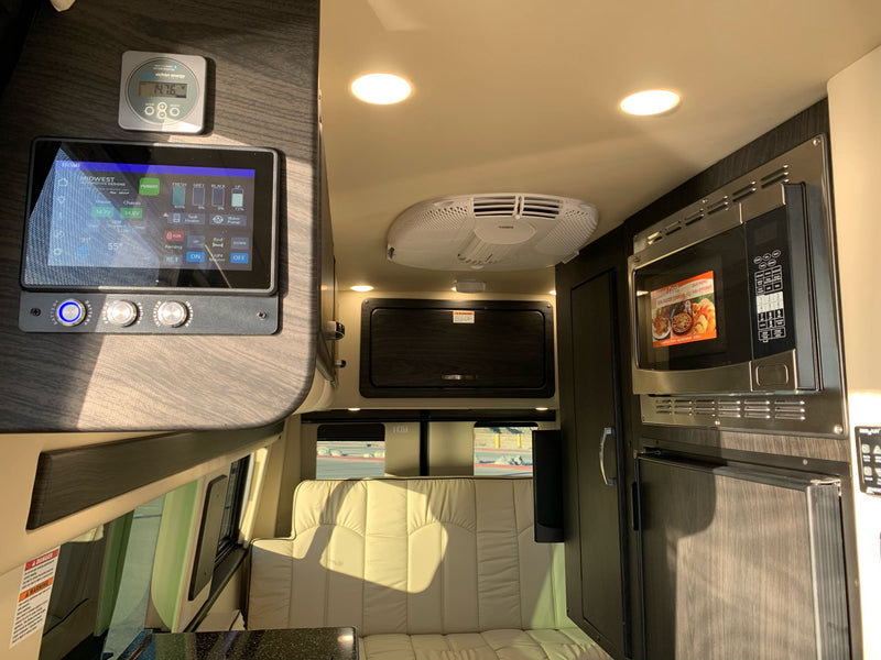  and climate settings.|RV rental dashboard with navigation display — photo 16