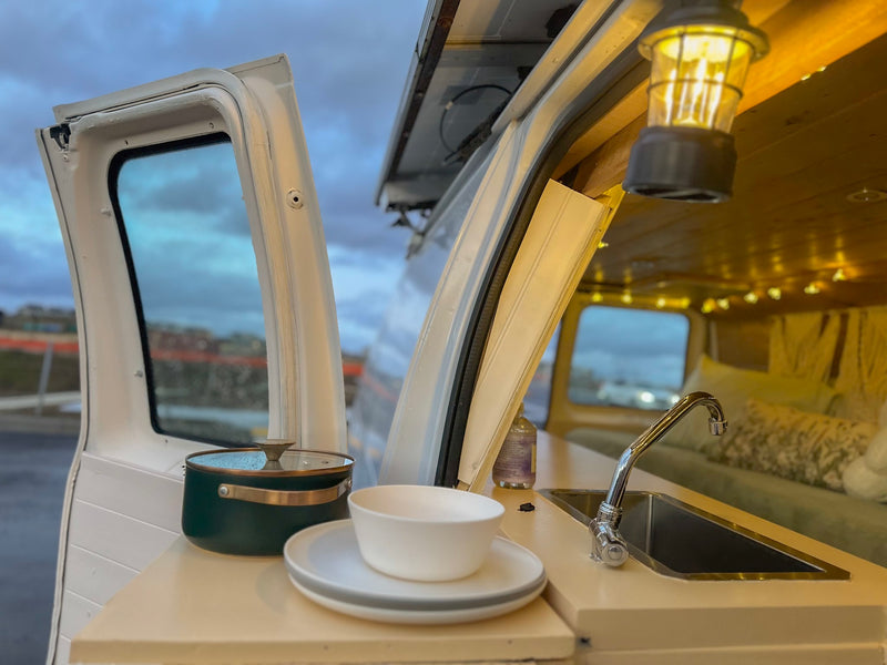  and wooden details.|Cozy RV rental interior: featuring a comfy bed — photo 14