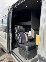 Step into comfort! This RV rental van boasts a plush seat, cozy bunk, and sleek storage, ideal for road trips.