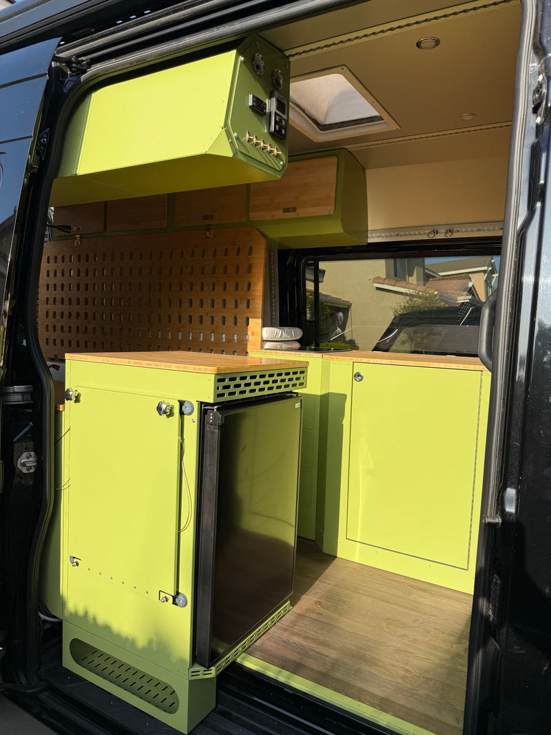  ideal for an RV rental adventure.|Explore our RV rental! This customized camper van interior features a modular pegboard wall — photo 7