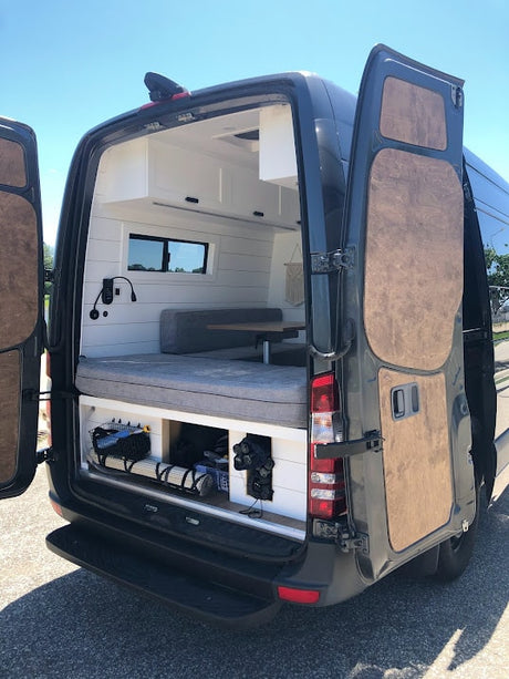  and a seating area for your adventures.|Bright RV rental interior: modern kitchen with wood counters