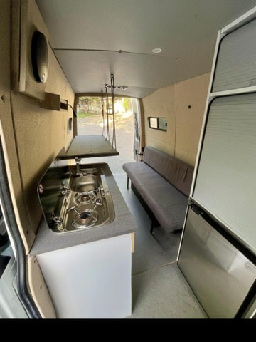  and majestic mountains. Perfect for scenic van life adventures in a beautiful setting.|RV rental van conversion: custom wooden bench — photo 4