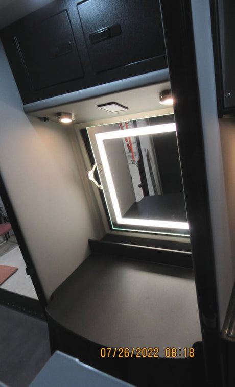  and window blinds for comfortable mobile living.|RV rental interior: Bright white seating/beds