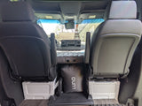 Cozy rv rental setup: an inflatable mattress fits perfectly between front seats for a comfortable night in this camper van.