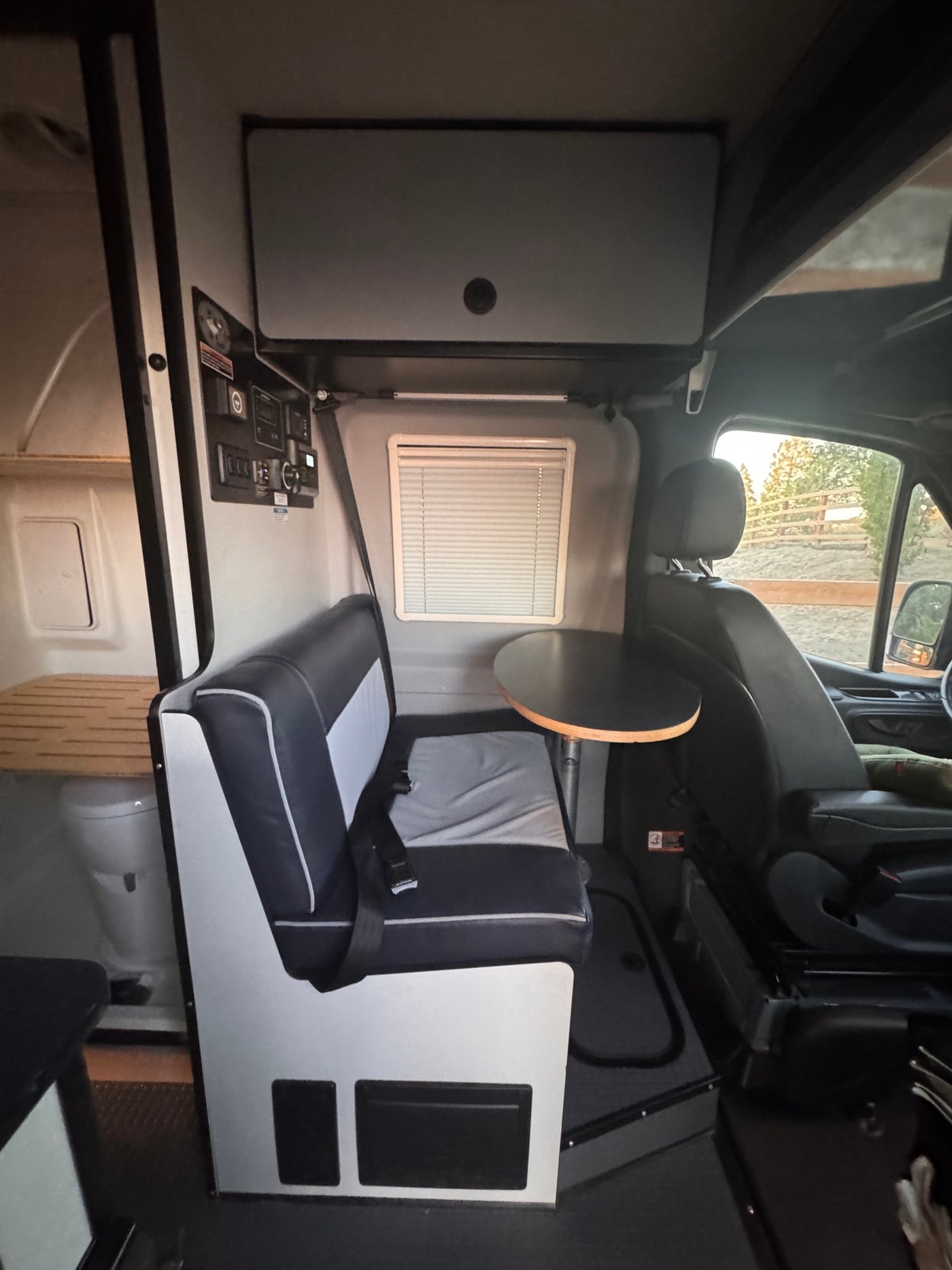  perfect as an rv rental for rugged exploration.|Adventure-ready RV rental: grey camper van with open rear — photo 5