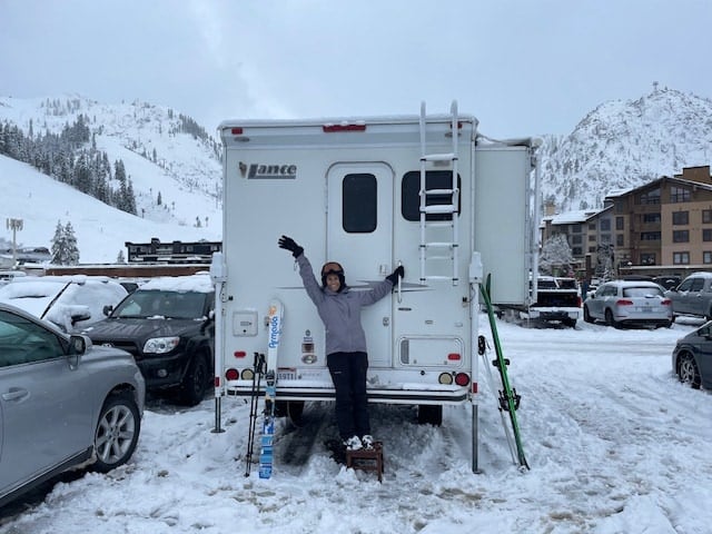  with an ice pack in the top section.|Cozy RV rental interior: bunk beds with light bedding and a plaid blanket behind a sliding door — photo 18