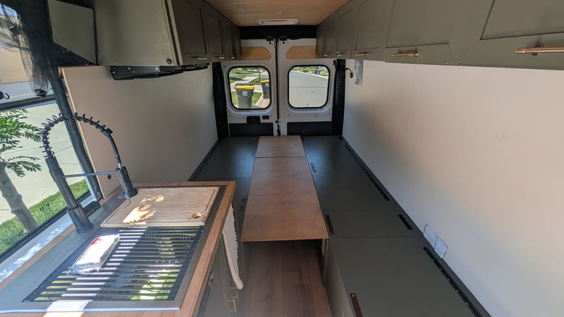 This RV rental's interior reveals a modern van conversion with a kitchen sink — photo 1