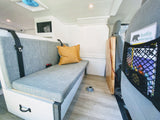 Explore this cozy RV rental's interior: comfy bench with seatbelts, clever storage, fan, and 'BearWise' tips for safe travels.