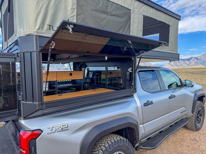  with a Tune Outdoor rooftop tent and organized bed storage