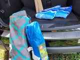 Camping chairs, towels, and outdoor gear packed for an RV rental adventure.