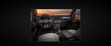 Jeep's rugged interior, perfect for an rv rental road trip. Features dashboard, steering wheel, and desert landscape views.
