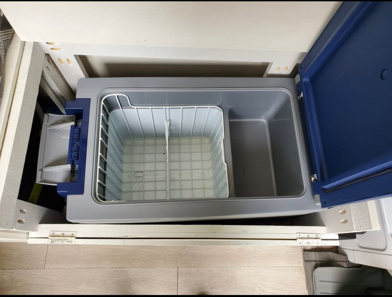 RV rental: Open portable fridge, showing wire basket. Ideal for camping & travel, offering mobile cooling convenience. — photo 18