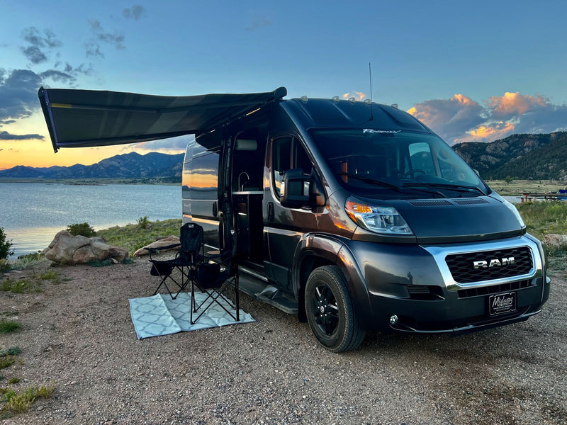  cloudy sky.|RV rental van offers stunning lakefront sunset views at a scenic campsite for your nature travel adventure.|Stylish dark gray rv rental camper van parked by a scenic lake at sunset with mountains and camping chairs set up.|Cozy RV rental interior with a stunning lake and mountain view at dusk. Ideal for peaceful getaways.|Inside a cozy rv rental with a modern kitchenette — photo 10