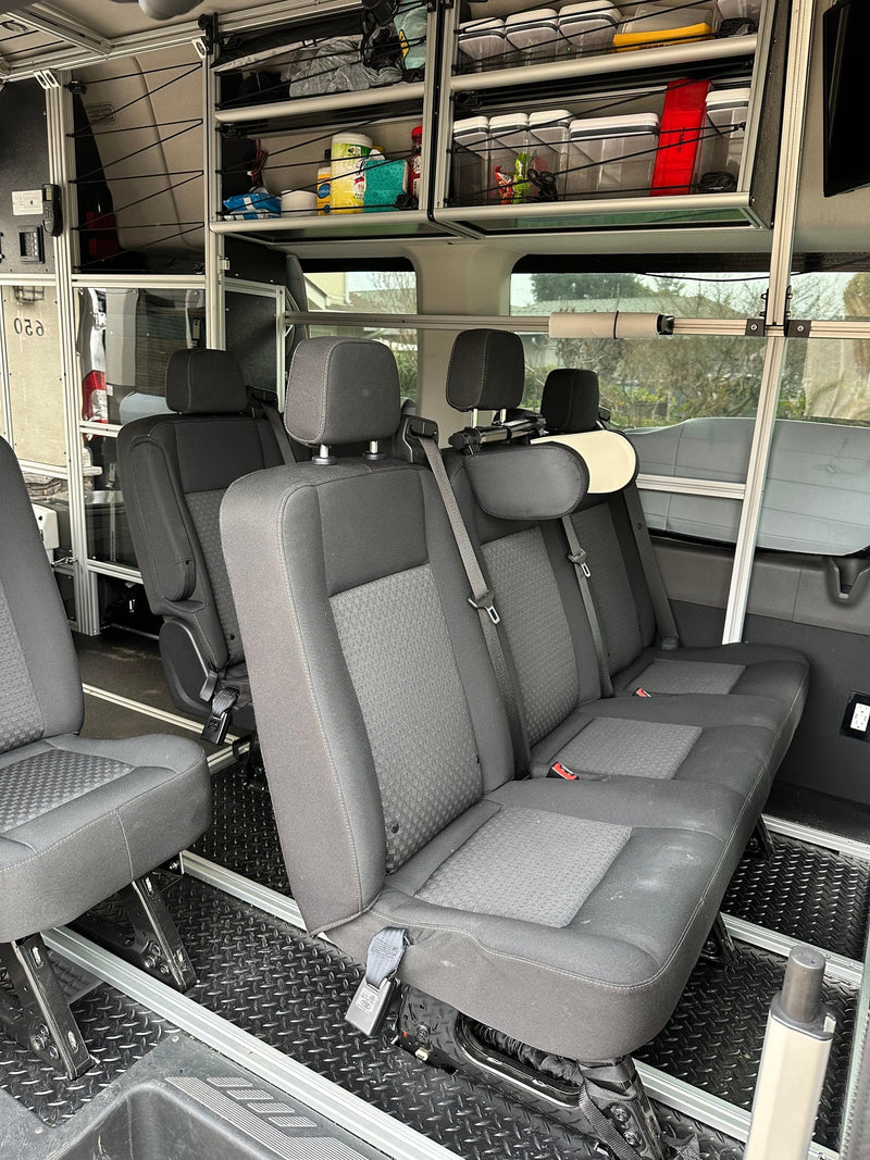  and portable toilet create a versatile mobile office and living space.|RV rental interior with a composting toilet — photo 5